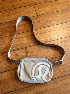 lululemon athletica Beige Crossbody Belt Bag with White Logo